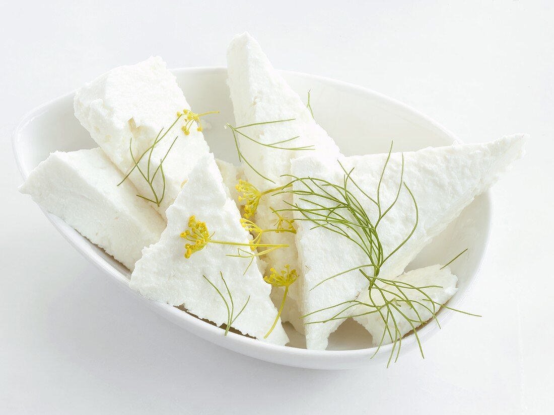 Feta cheese with dill in a small dish