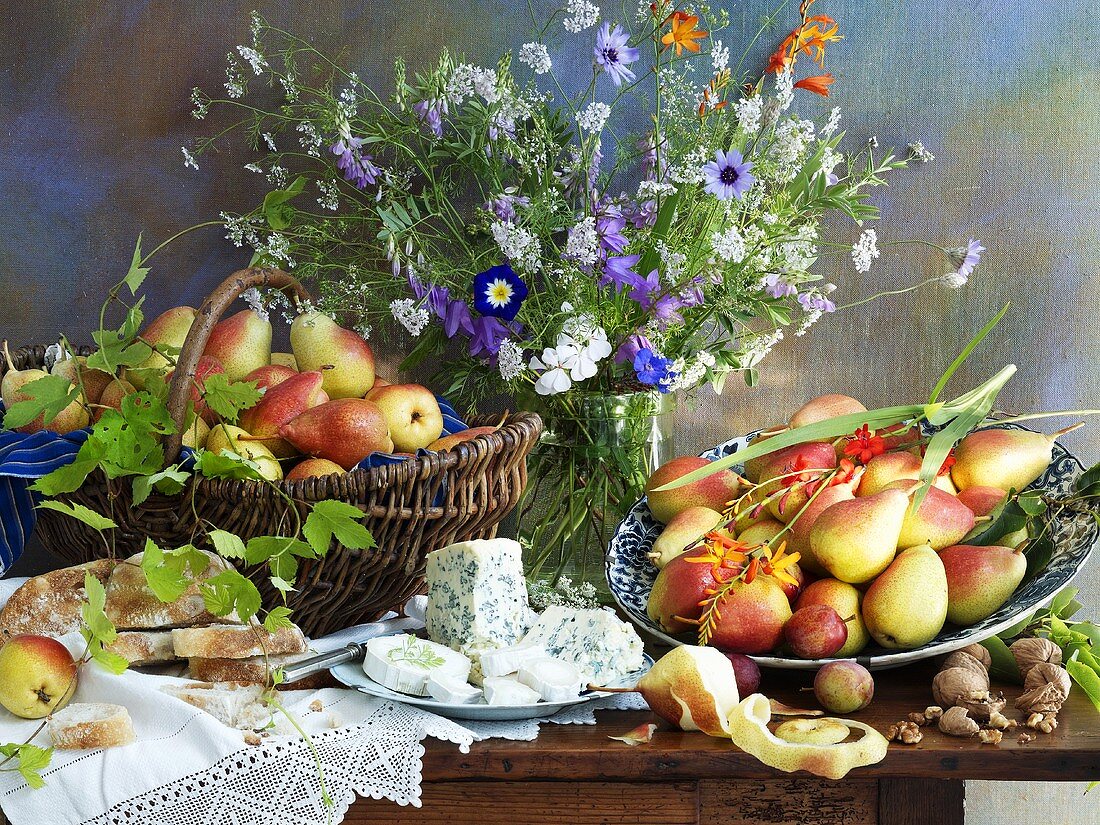 Still life with pears, cheese and a vase of flowers