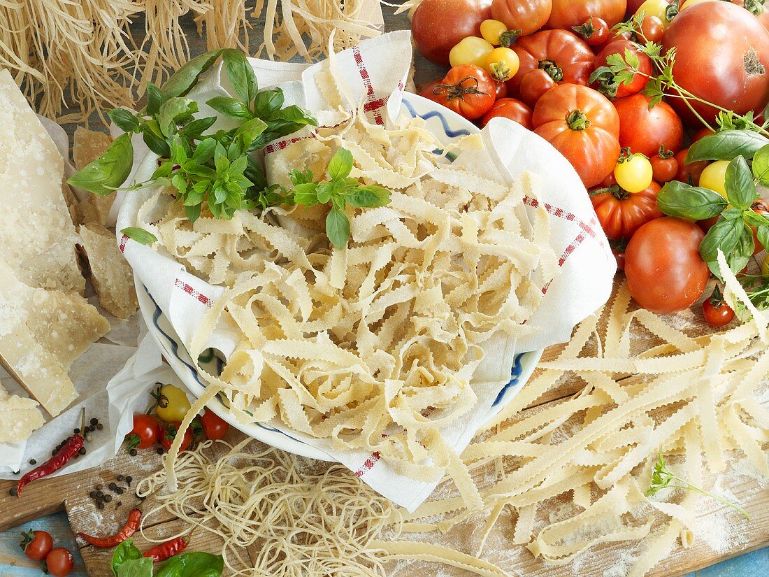 Home-made pasta with tomatoes, basil, spices