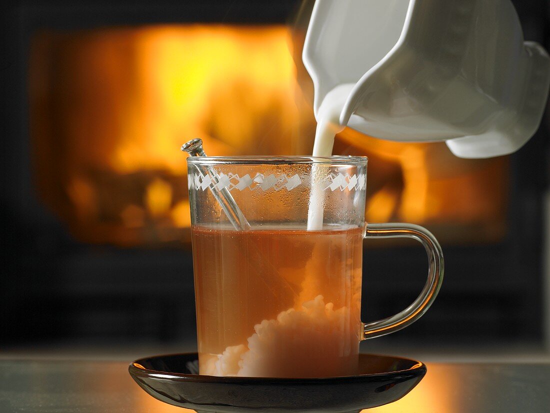 Tea with cream in front of open fire