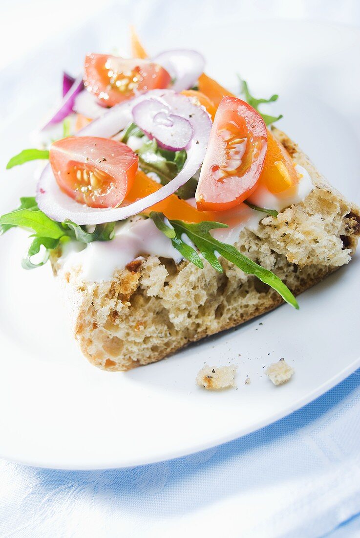 Tomato, onion and rocket on wholemeal baguette