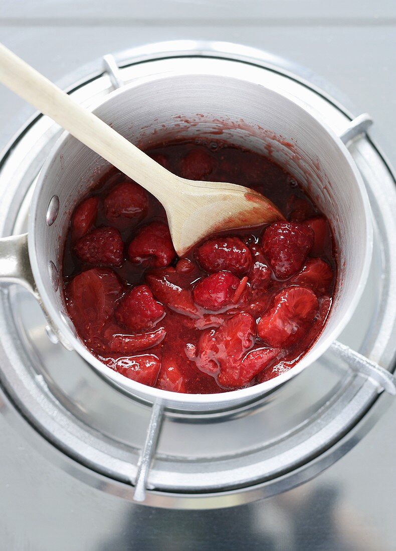 Making berry sauce (warming berries in bain-marie)