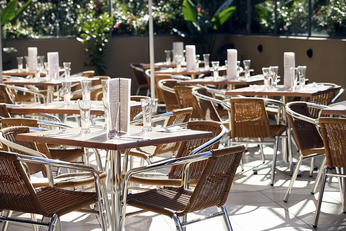 Laid tables outside cafe