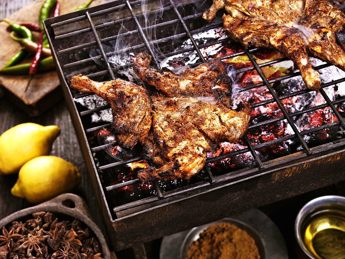 Chickens with exotic spices on a barbecue