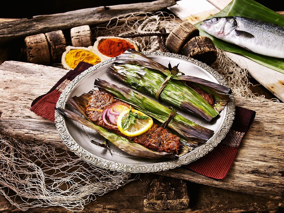 Sea bass with exotic spices grilled in banana leaves