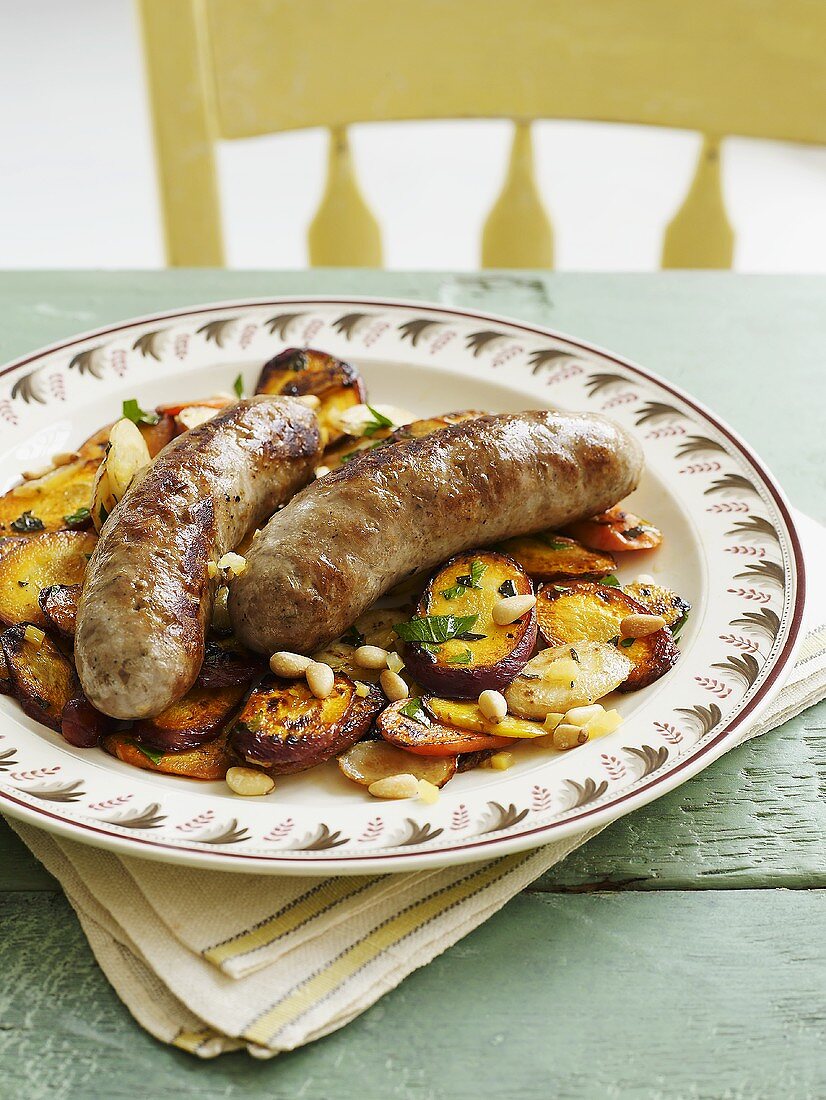 Lamb sausages with vegetables and pine nuts