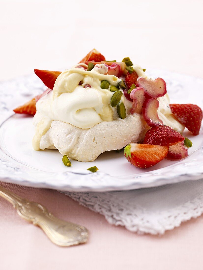 Meringue with whipped cream, strawberries, rhubarb and chocolate