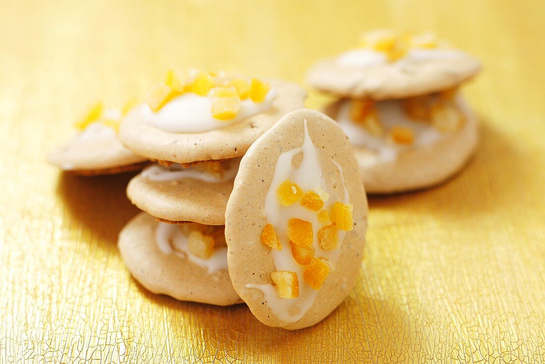 Almond macaroons with icing and orange peel