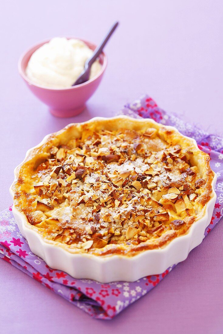 Almond apple tart with whipped cream