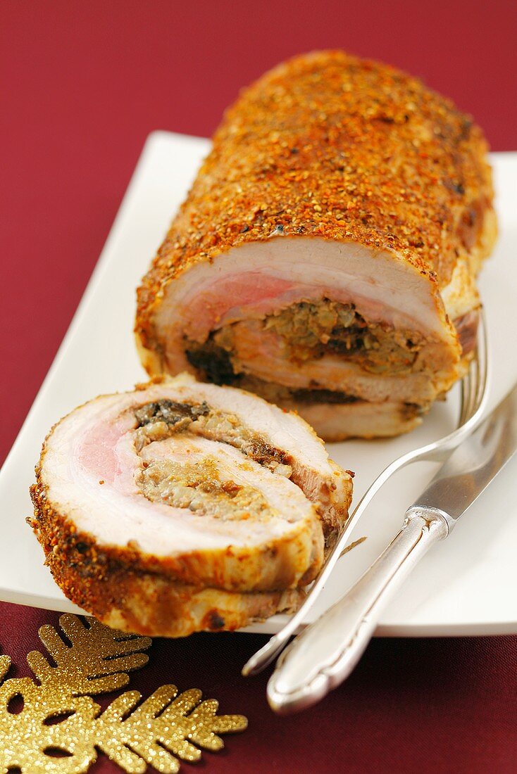 Rolled roasted belly pork with buckwheat and plum stuffing