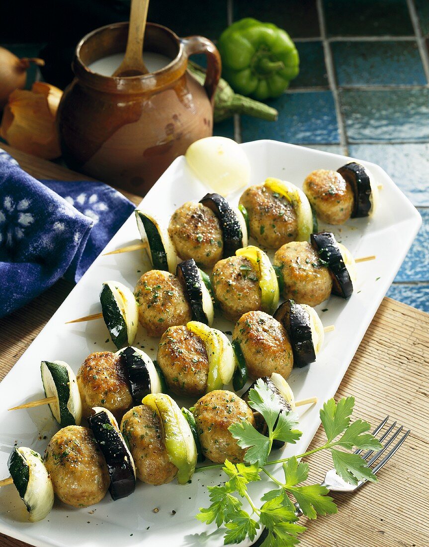 Poultry ball, aubergine and pepper kebabs