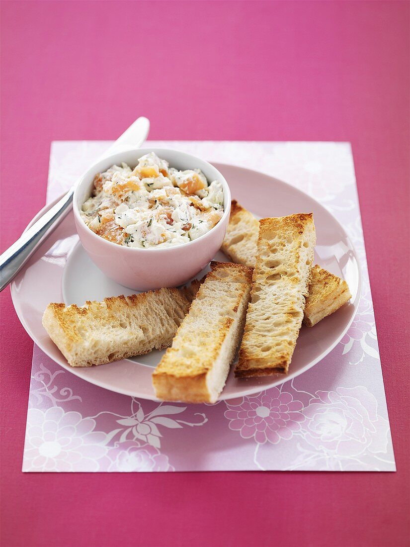 Smoked salmon and goat's cheese spread and fingers of toast