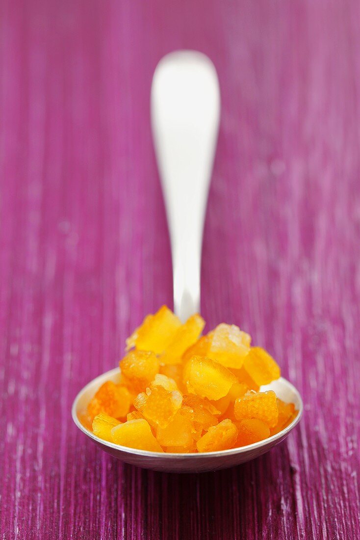 Candied orange peel on spoon