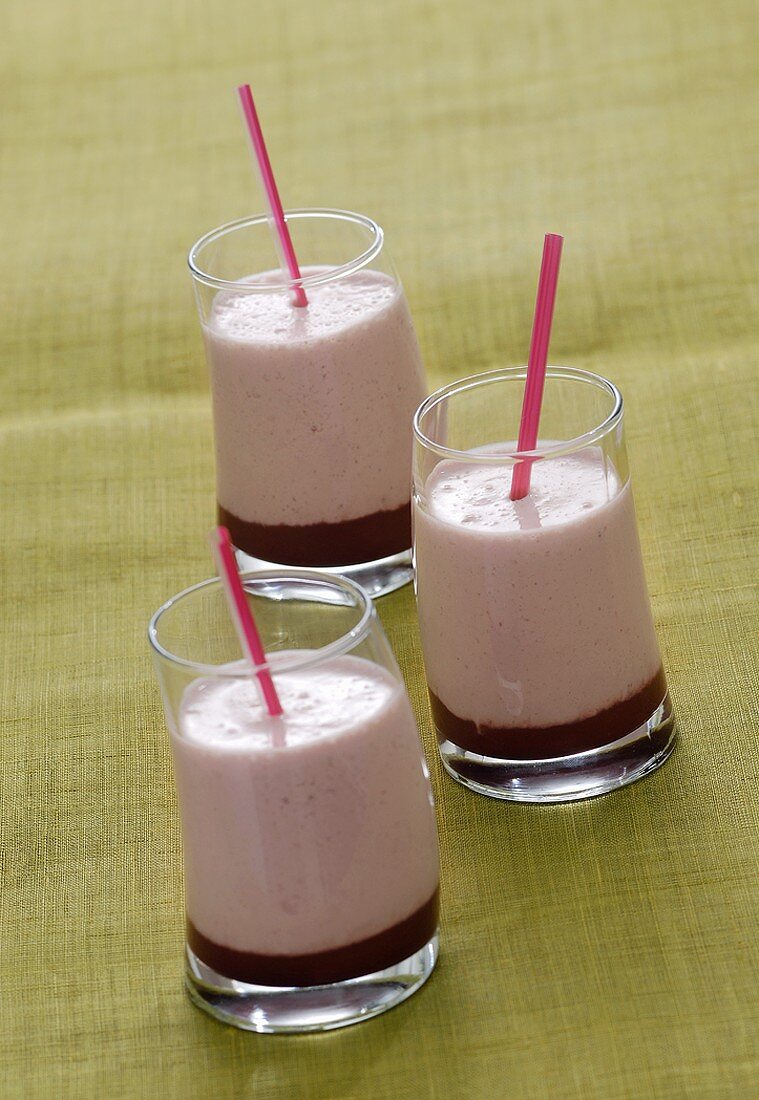 Three strawberry milkshakes