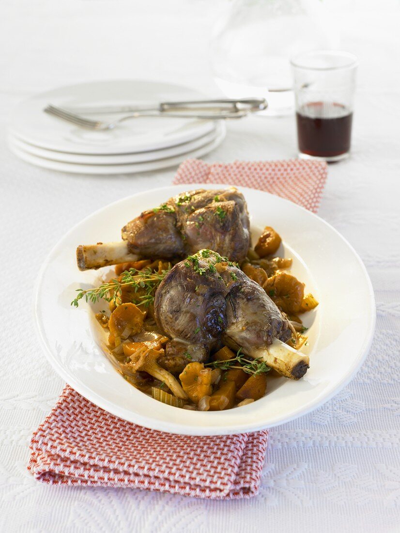 Braised lamb shanks with chanterelles and thyme