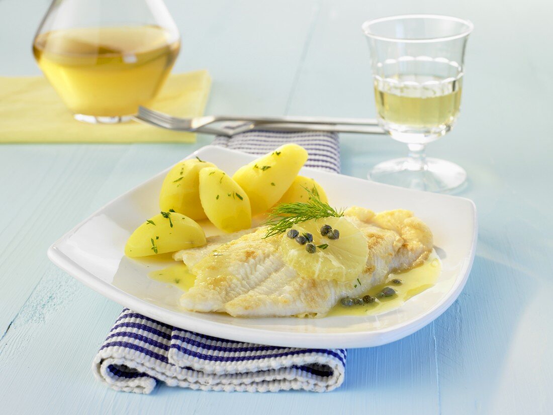 Sole with white wine and caper sauce and new potatoes