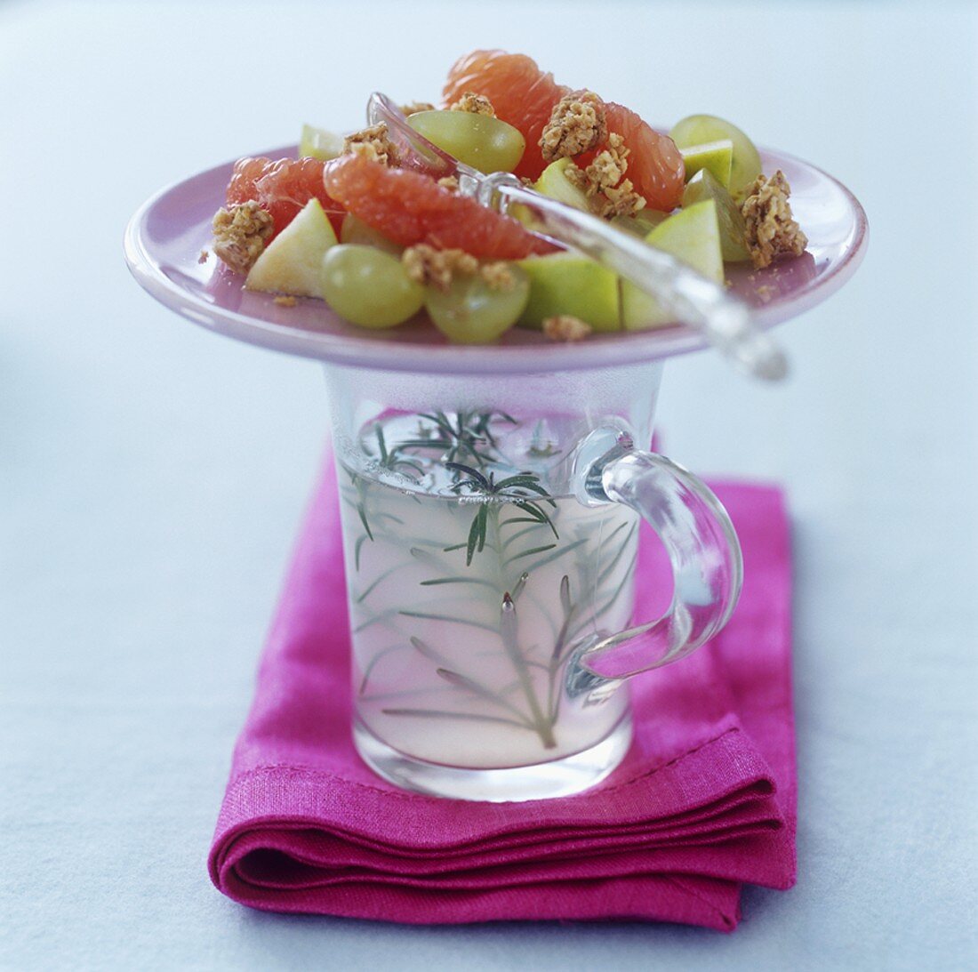 Hot lemon with rosemary and fruit salad