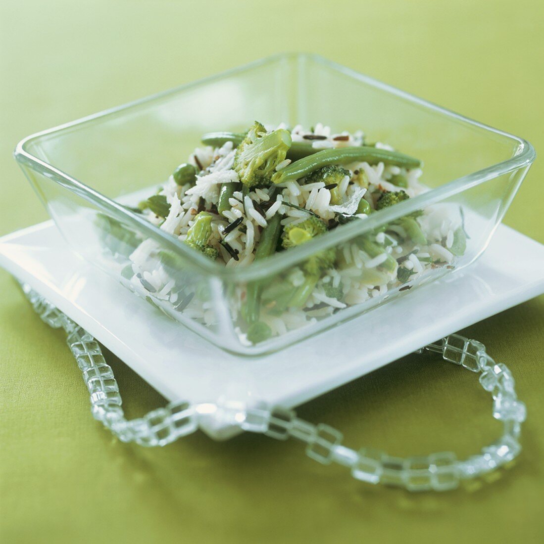 Rice with green vegetables in a glass dish