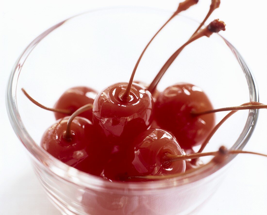Cocktail cherries in a small dish