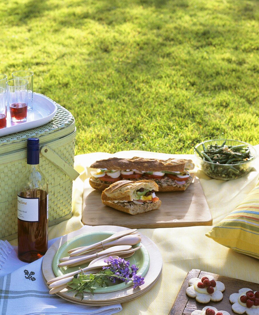 Picnic with baguette sandwiches and bean salad