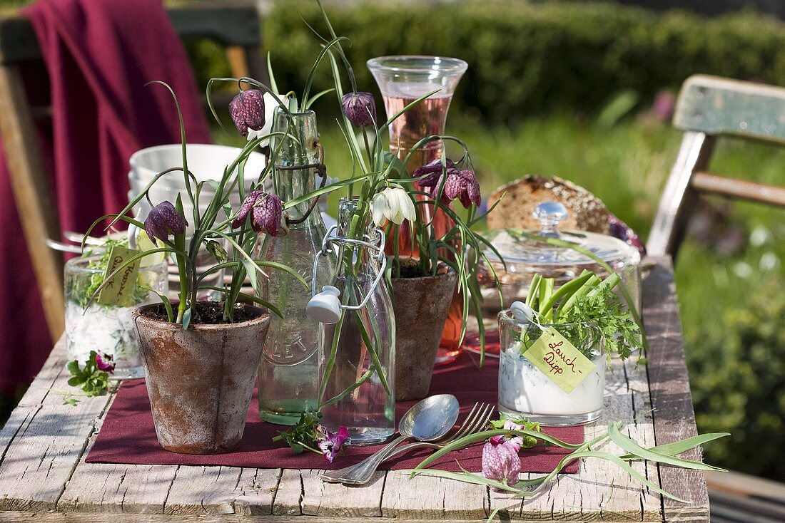 Fritillaries in flip-top bottles & flowerpots (table decoration)