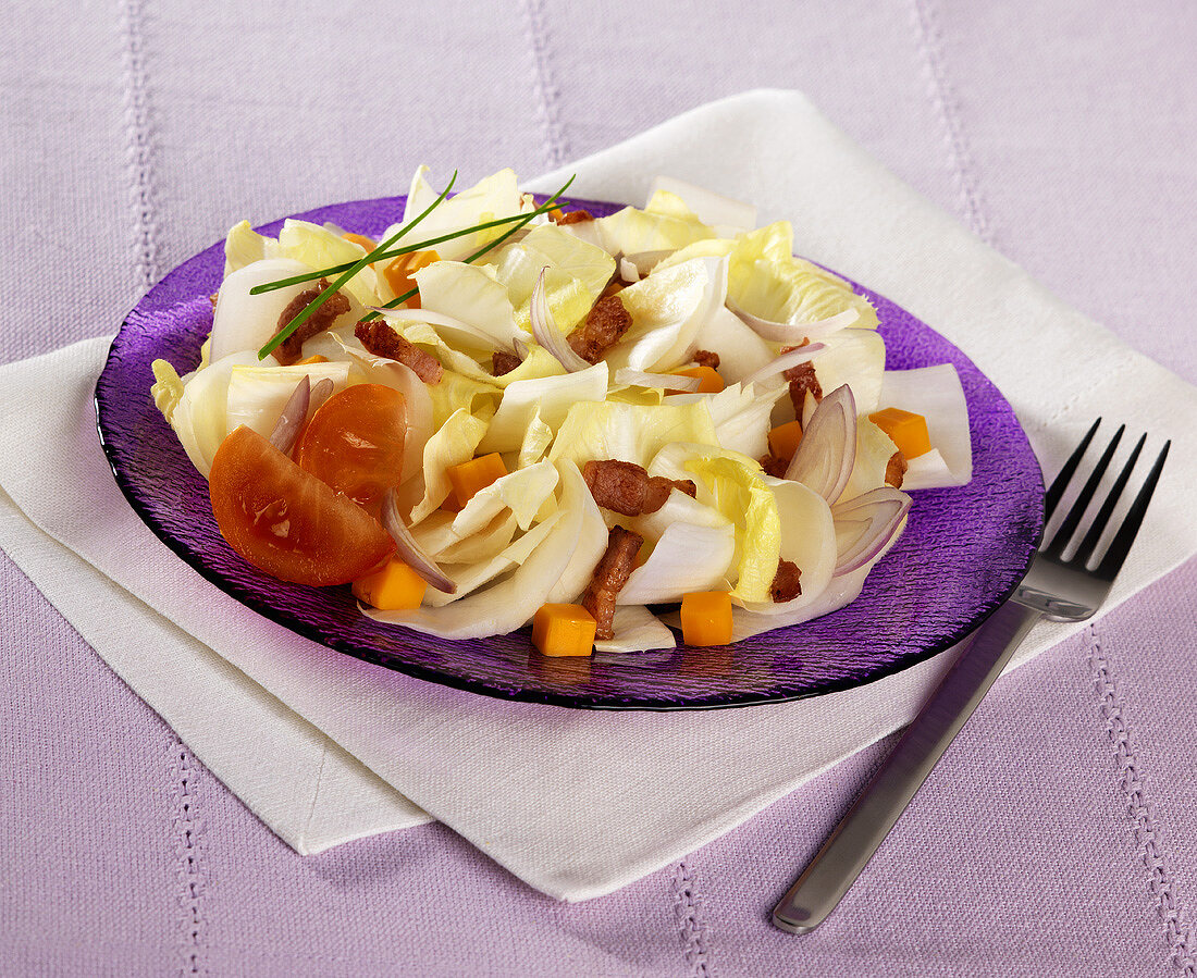 Chicory salad with Mimolette cheese and bacon