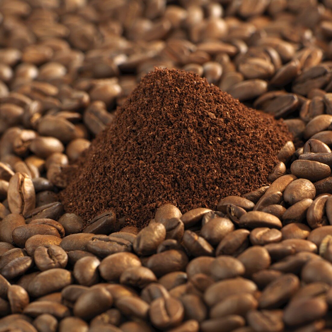 Freshly ground organic coffee and coffee beans