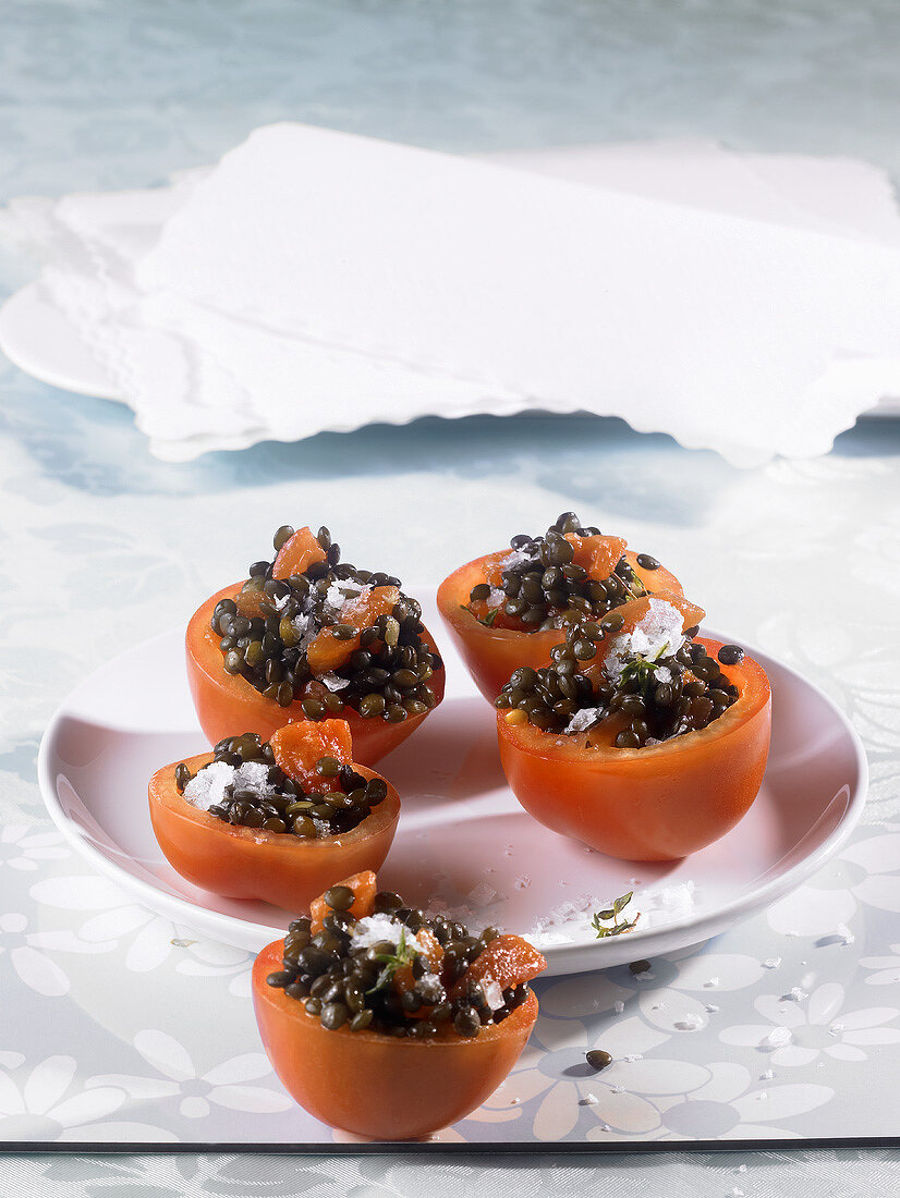 Hollowed-out tomatoes filled with lentil salad