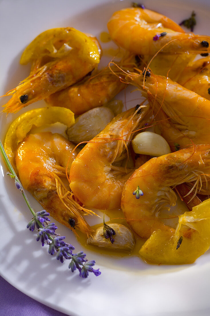 Fried prawns with lavender flowers and garlic