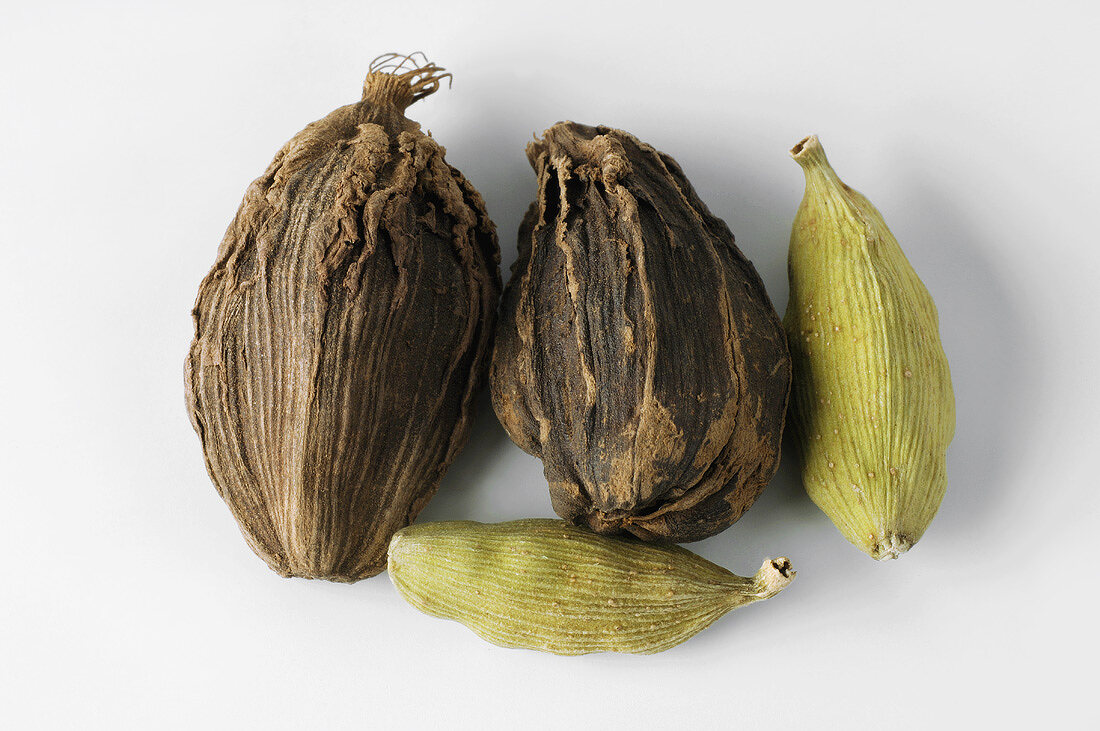 Brown and green cardamom pods