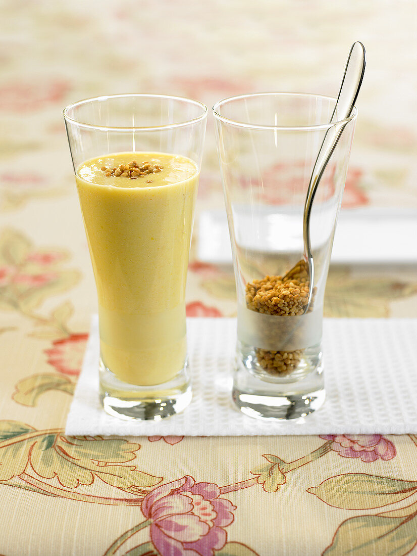 Peach and banana smoothie with nut brittle