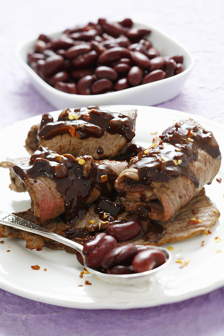 Beef roulades with red kidney beans and chocolate sauce