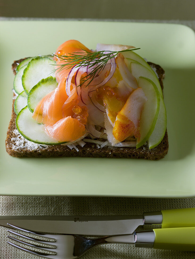 Soft cheese, cucumber and smoked salmon on bread