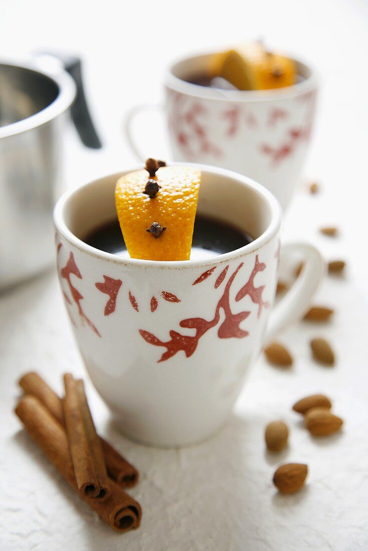 Mulled wine with clove-studded orange and cinnamon