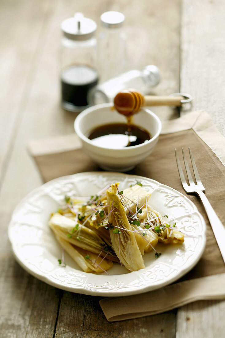 Steamed chicory with honey and red cabbage sprouts