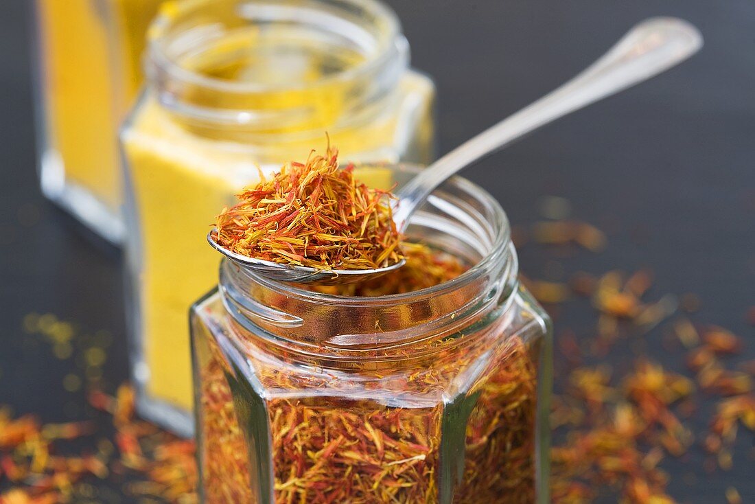 Saffron and curry powder in jars