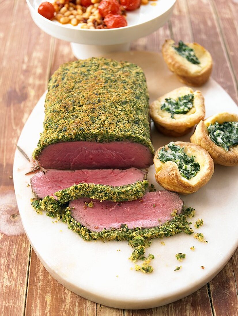 Roast beef with herb crust and filled Yorkshire puddings