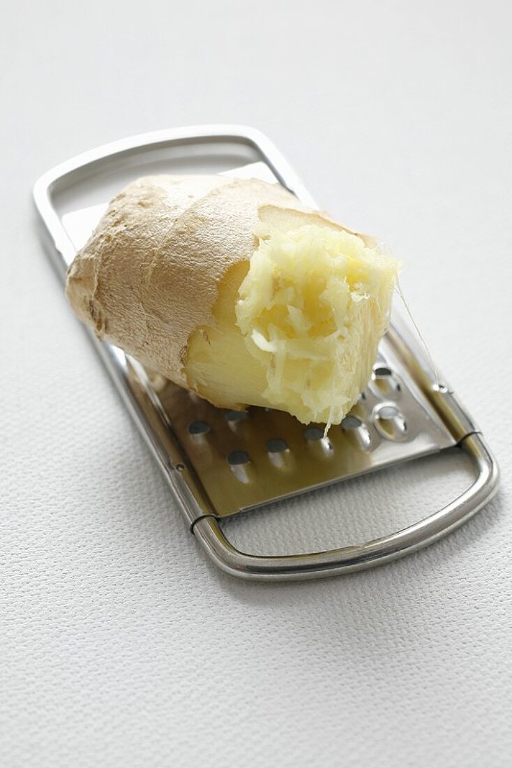 Ginger root on a grater