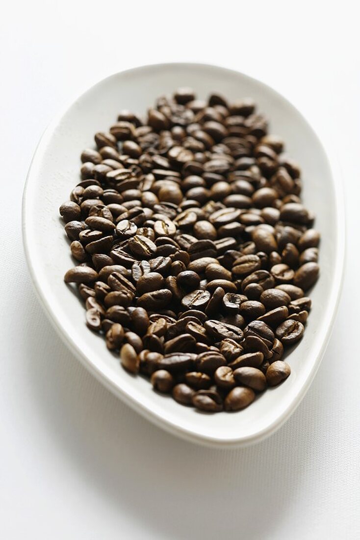 Coffee beans in white dish