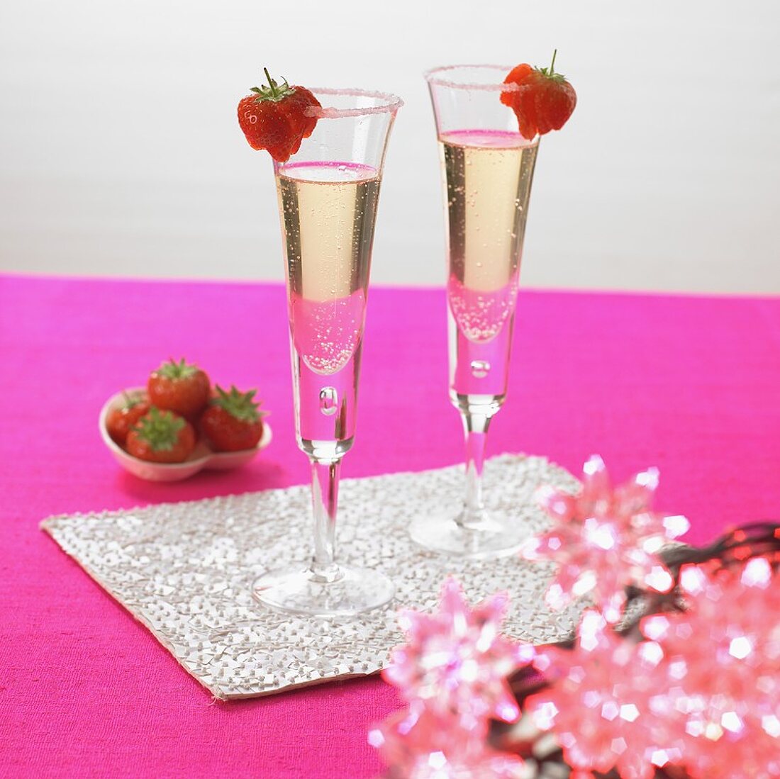 Two glasses of sparkling wine with strawberries