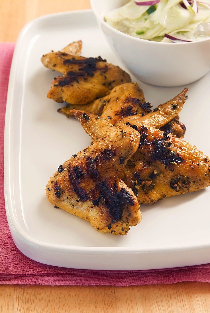 Grilled chicken wings and salad