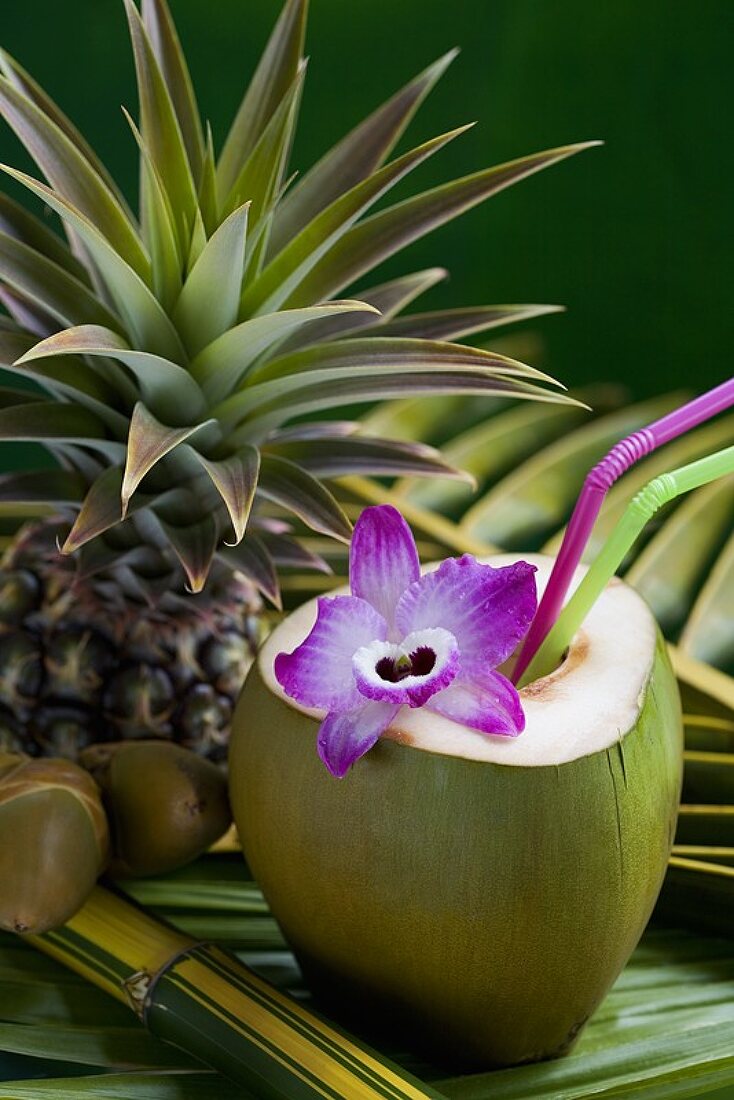 Coconut milk in hollowed-out green coconut