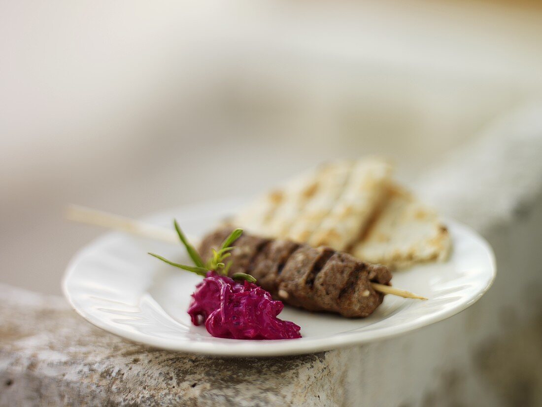 Lamb kebab with beetroot salad and pita bread (Greece)