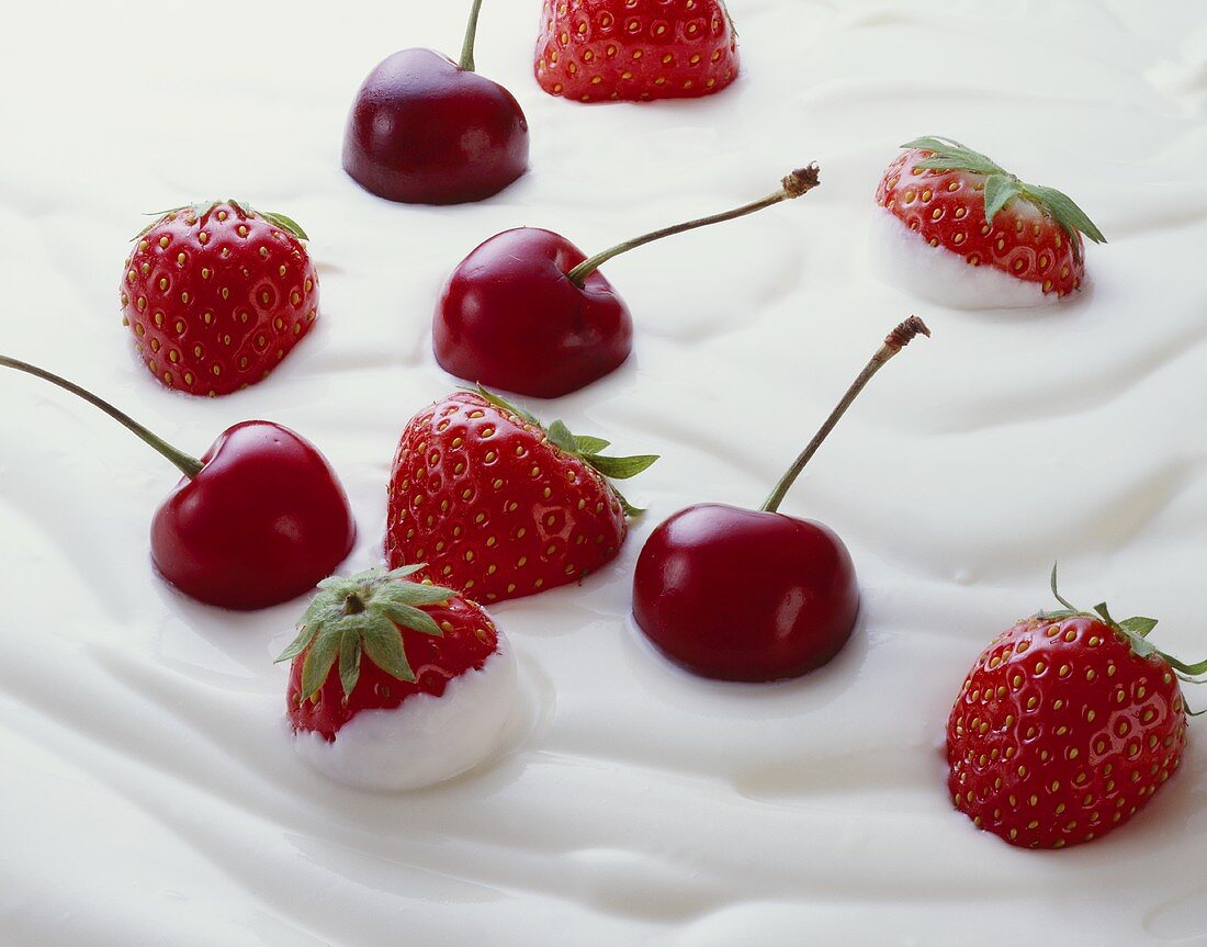Fresh strawberries and cherries in yoghurt