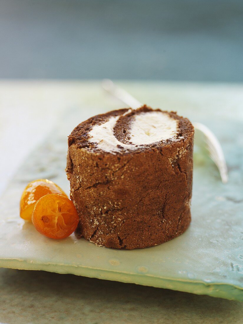 Chocolate roulade with punch cream filling and kumquats