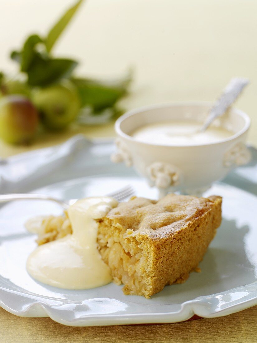 A piece of apple pie with custard