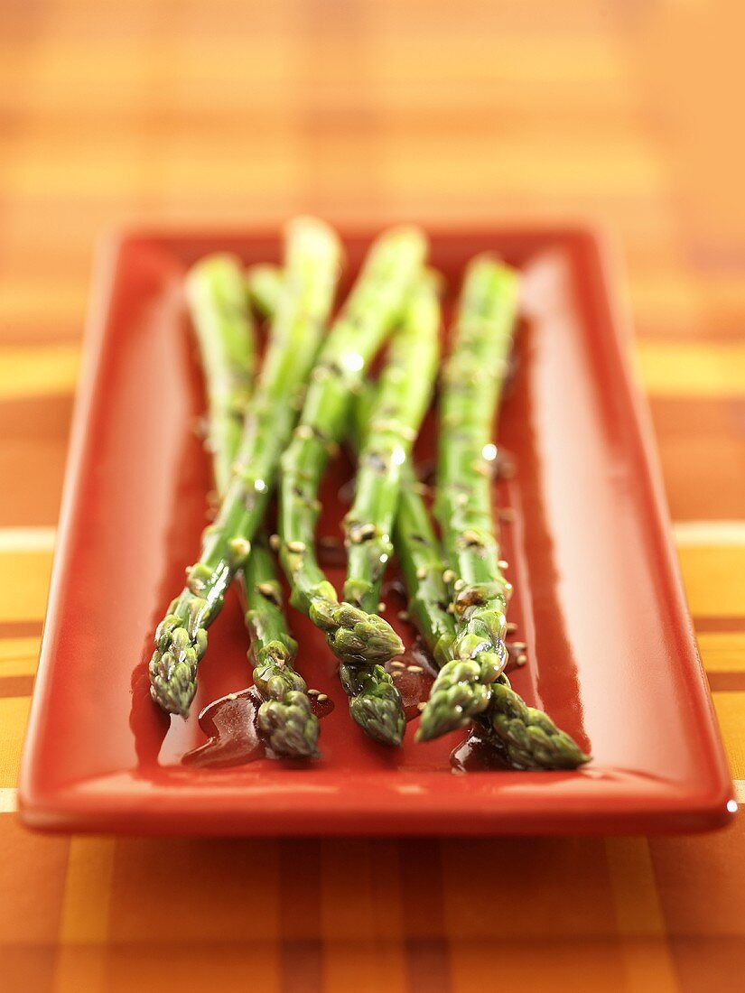 Grilled green asparagus with soy sauce and sesame seeds