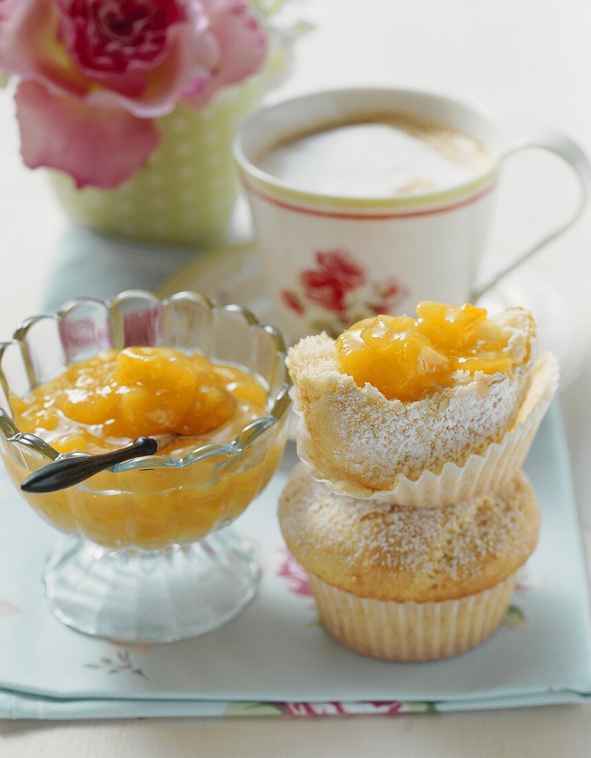 Peach jam, muffins and milky coffee