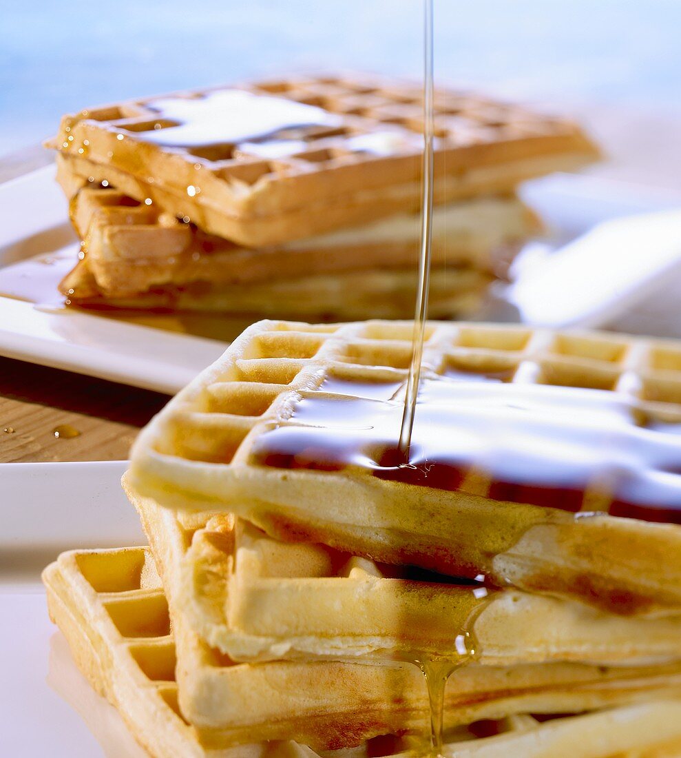 Waffles and apple and cinnamon waffles with maple syrup