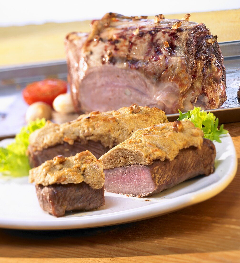 Lamb fillet with peanut cream and leg of lamb with garlic